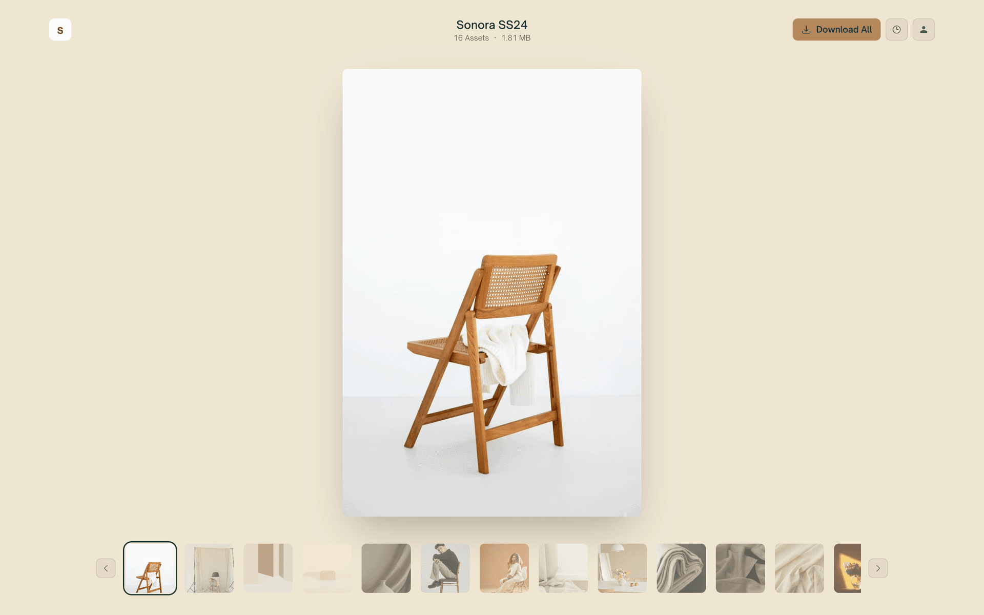 A warm cream Reel download page with one featured photo and a thumbnail strip
